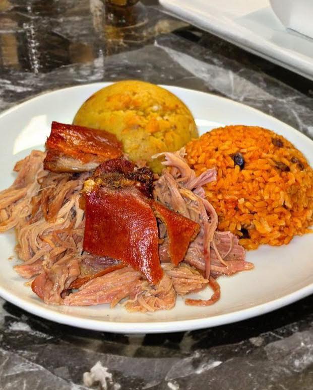 Pernil with crispy skin, arroz con gandules, and mofongo — Puerto Rican food near Fort Hood